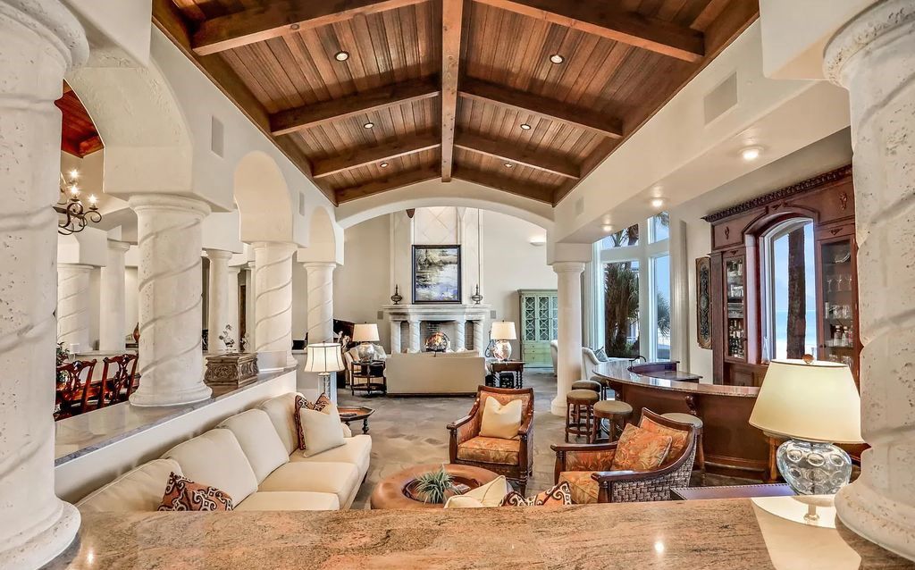 Step into the epitome of coastal luxury at 1263 Ponte Vedra Blvd, an awe-inspiring custom estate in Ponte Vedra Beach. Perched on a high bluff with 200' of ocean-frontage, this 12,751-square-foot sanctuary boasts 6 ensuite bedrooms, 7 full and 3 half baths, a media room, elevator, and a wine cellar for 2200 bottles.