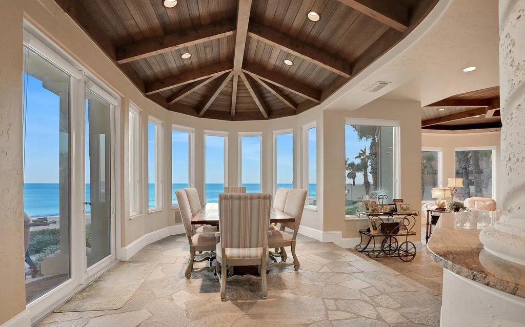 Step into the epitome of coastal luxury at 1263 Ponte Vedra Blvd, an awe-inspiring custom estate in Ponte Vedra Beach. Perched on a high bluff with 200' of ocean-frontage, this 12,751-square-foot sanctuary boasts 6 ensuite bedrooms, 7 full and 3 half baths, a media room, elevator, and a wine cellar for 2200 bottles.