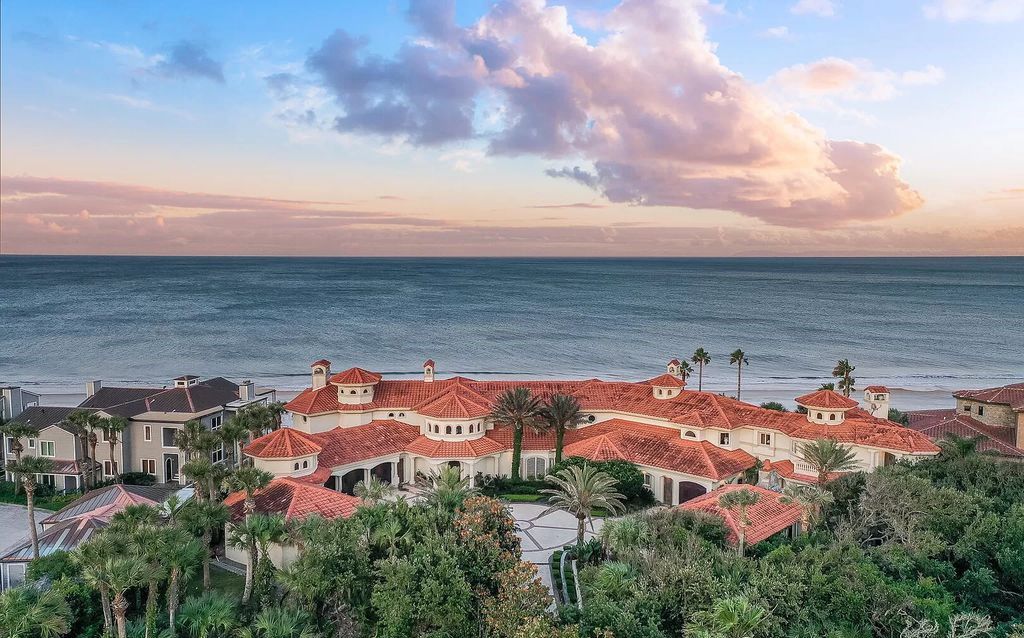 Step into the epitome of coastal luxury at 1263 Ponte Vedra Blvd, an awe-inspiring custom estate in Ponte Vedra Beach. Perched on a high bluff with 200' of ocean-frontage, this 12,751-square-foot sanctuary boasts 6 ensuite bedrooms, 7 full and 3 half baths, a media room, elevator, and a wine cellar for 2200 bottles.