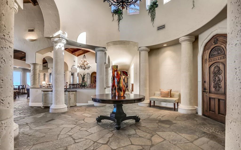 Step into the epitome of coastal luxury at 1263 Ponte Vedra Blvd, an awe-inspiring custom estate in Ponte Vedra Beach. Perched on a high bluff with 200' of ocean-frontage, this 12,751-square-foot sanctuary boasts 6 ensuite bedrooms, 7 full and 3 half baths, a media room, elevator, and a wine cellar for 2200 bottles.