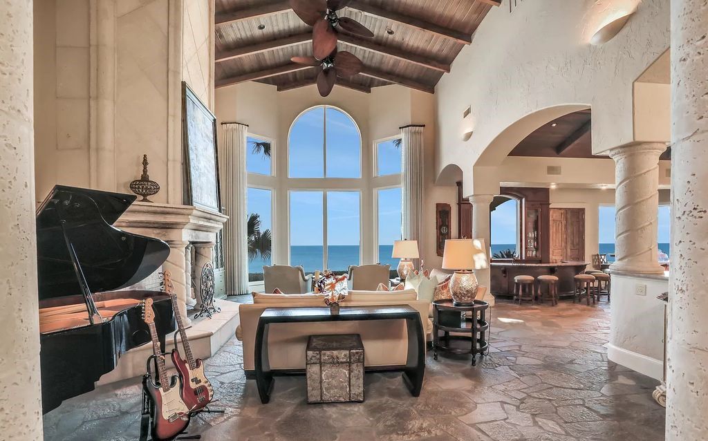 Step into the epitome of coastal luxury at 1263 Ponte Vedra Blvd, an awe-inspiring custom estate in Ponte Vedra Beach. Perched on a high bluff with 200' of ocean-frontage, this 12,751-square-foot sanctuary boasts 6 ensuite bedrooms, 7 full and 3 half baths, a media room, elevator, and a wine cellar for 2200 bottles.
