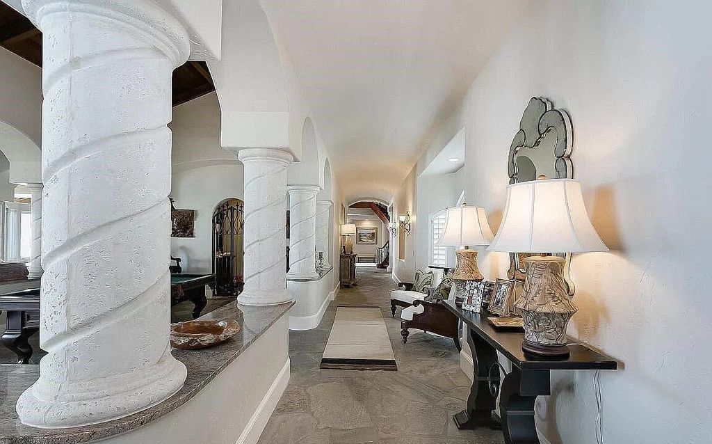 Step into the epitome of coastal luxury at 1263 Ponte Vedra Blvd, an awe-inspiring custom estate in Ponte Vedra Beach. Perched on a high bluff with 200' of ocean-frontage, this 12,751-square-foot sanctuary boasts 6 ensuite bedrooms, 7 full and 3 half baths, a media room, elevator, and a wine cellar for 2200 bottles.