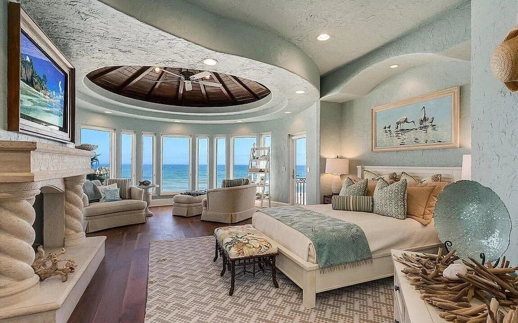 Step into the epitome of coastal luxury at 1263 Ponte Vedra Blvd, an awe-inspiring custom estate in Ponte Vedra Beach. Perched on a high bluff with 200' of ocean-frontage, this 12,751-square-foot sanctuary boasts 6 ensuite bedrooms, 7 full and 3 half baths, a media room, elevator, and a wine cellar for 2200 bottles.