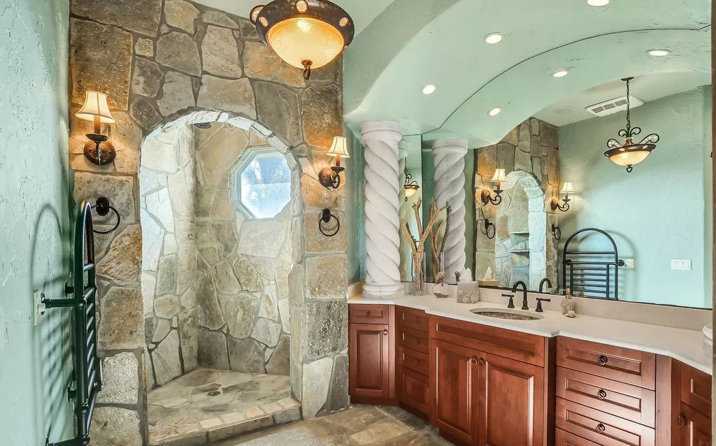 Step into the epitome of coastal luxury at 1263 Ponte Vedra Blvd, an awe-inspiring custom estate in Ponte Vedra Beach. Perched on a high bluff with 200' of ocean-frontage, this 12,751-square-foot sanctuary boasts 6 ensuite bedrooms, 7 full and 3 half baths, a media room, elevator, and a wine cellar for 2200 bottles.