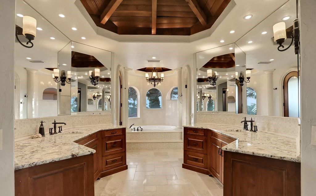 Step into the epitome of coastal luxury at 1263 Ponte Vedra Blvd, an awe-inspiring custom estate in Ponte Vedra Beach. Perched on a high bluff with 200' of ocean-frontage, this 12,751-square-foot sanctuary boasts 6 ensuite bedrooms, 7 full and 3 half baths, a media room, elevator, and a wine cellar for 2200 bottles.