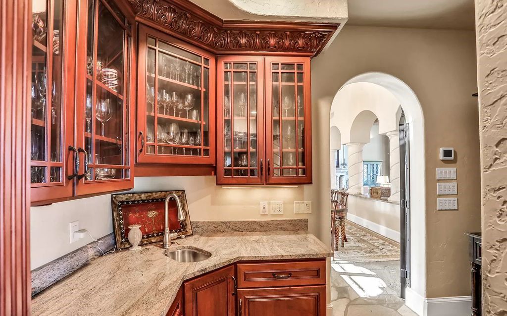 Step into the epitome of coastal luxury at 1263 Ponte Vedra Blvd, an awe-inspiring custom estate in Ponte Vedra Beach. Perched on a high bluff with 200' of ocean-frontage, this 12,751-square-foot sanctuary boasts 6 ensuite bedrooms, 7 full and 3 half baths, a media room, elevator, and a wine cellar for 2200 bottles.