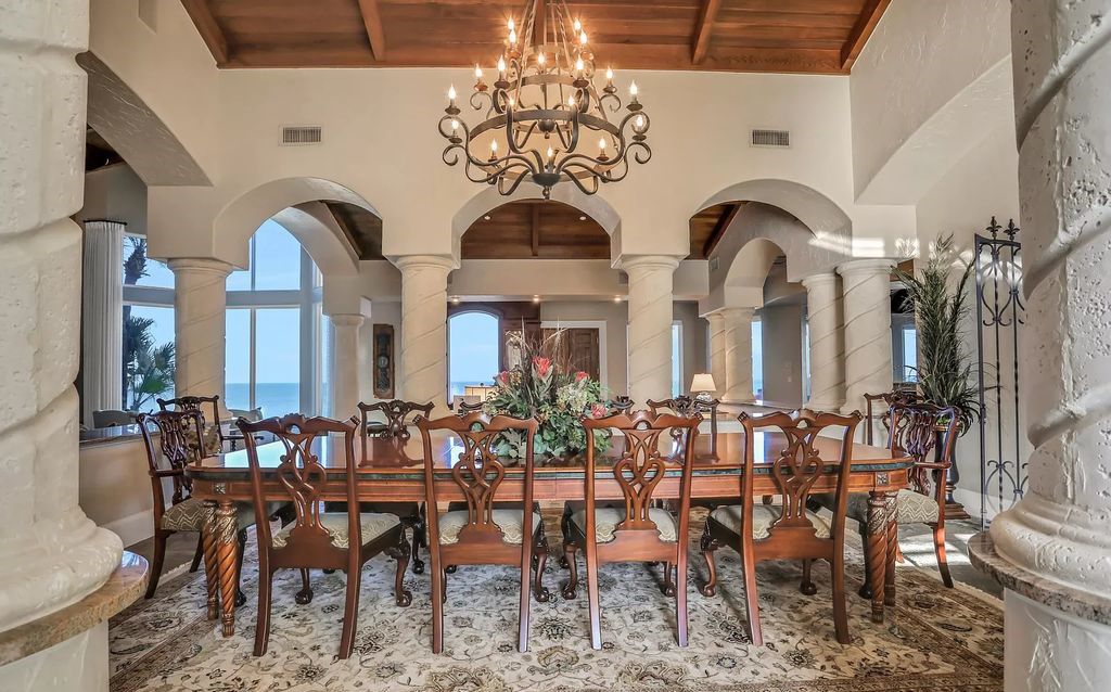 Step into the epitome of coastal luxury at 1263 Ponte Vedra Blvd, an awe-inspiring custom estate in Ponte Vedra Beach. Perched on a high bluff with 200' of ocean-frontage, this 12,751-square-foot sanctuary boasts 6 ensuite bedrooms, 7 full and 3 half baths, a media room, elevator, and a wine cellar for 2200 bottles.