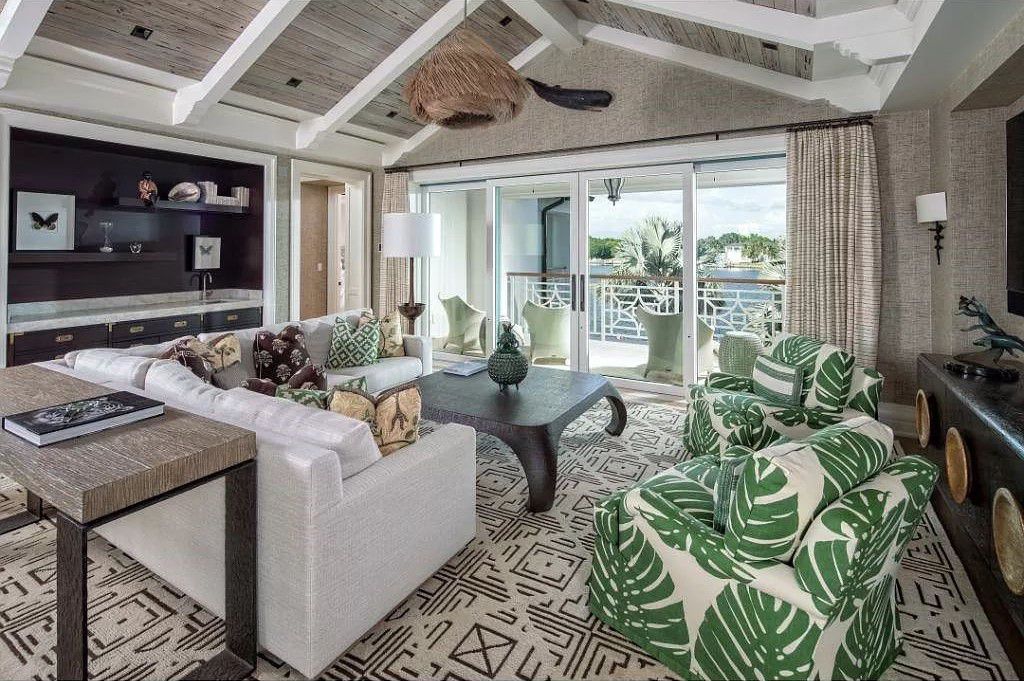 Indulge in the pinnacle of waterfront luxury at 3401 Rum Row, Naples, Florida. This exquisite property, with approximately 130 feet of shoreline, offers unparalleled vistas of Galleon Cove. Crafted by London Bay Construction, Inc. and designed by Stofft Cooney Architects, LLC, it harmonizes opulent interiors by Anthony Catalfano Interiors with lavish outdoor entertainment spaces.