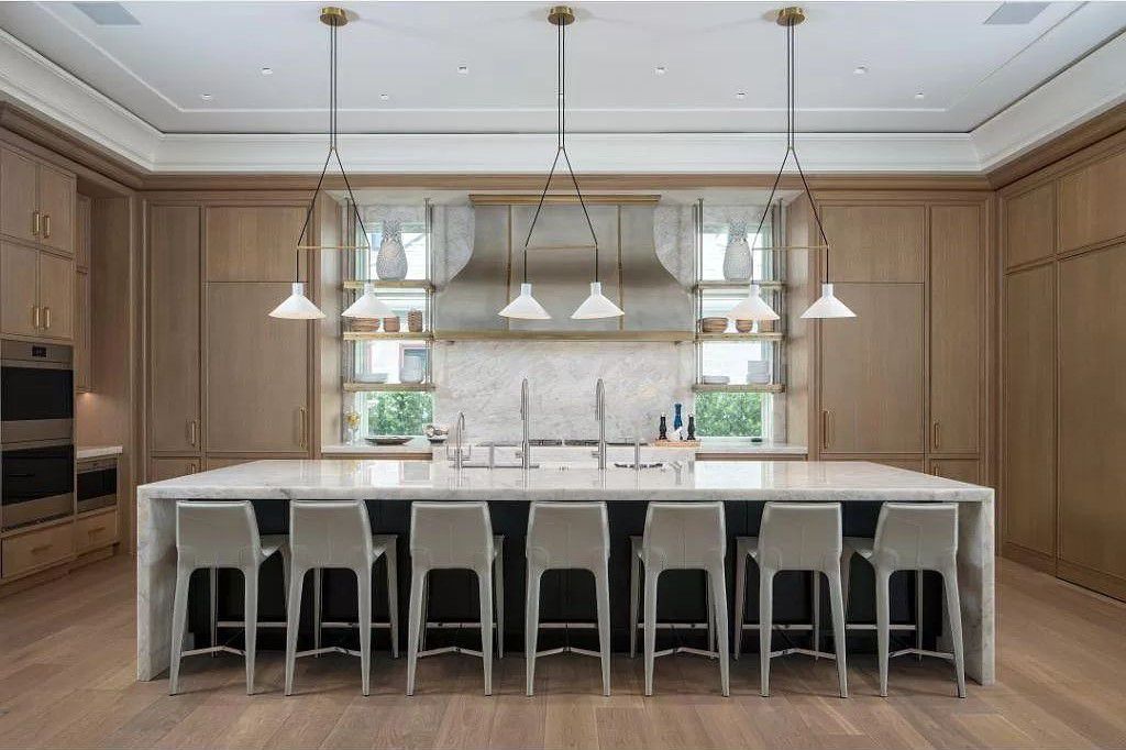Indulge in the pinnacle of waterfront luxury at 3401 Rum Row, Naples, Florida. This exquisite property, with approximately 130 feet of shoreline, offers unparalleled vistas of Galleon Cove. Crafted by London Bay Construction, Inc. and designed by Stofft Cooney Architects, LLC, it harmonizes opulent interiors by Anthony Catalfano Interiors with lavish outdoor entertainment spaces.