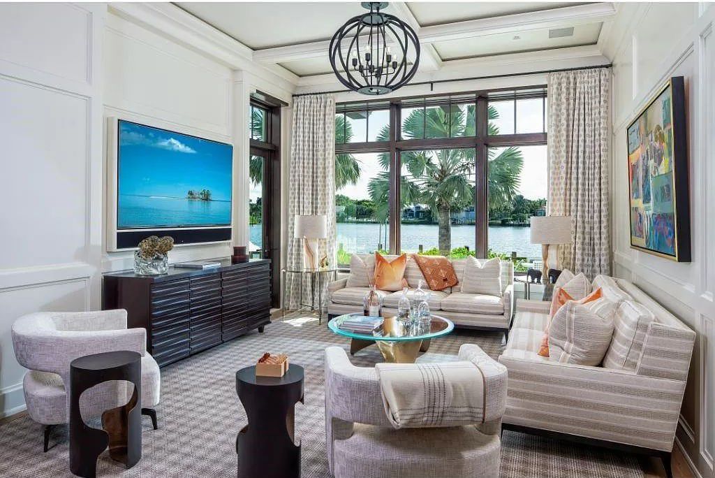 Indulge in the pinnacle of waterfront luxury at 3401 Rum Row, Naples, Florida. This exquisite property, with approximately 130 feet of shoreline, offers unparalleled vistas of Galleon Cove. Crafted by London Bay Construction, Inc. and designed by Stofft Cooney Architects, LLC, it harmonizes opulent interiors by Anthony Catalfano Interiors with lavish outdoor entertainment spaces.