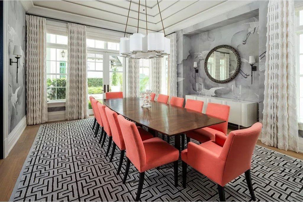 Indulge in the pinnacle of waterfront luxury at 3401 Rum Row, Naples, Florida. This exquisite property, with approximately 130 feet of shoreline, offers unparalleled vistas of Galleon Cove. Crafted by London Bay Construction, Inc. and designed by Stofft Cooney Architects, LLC, it harmonizes opulent interiors by Anthony Catalfano Interiors with lavish outdoor entertainment spaces.