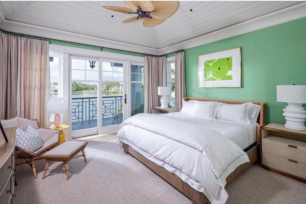 Indulge in the pinnacle of waterfront luxury at 3401 Rum Row, Naples, Florida. This exquisite property, with approximately 130 feet of shoreline, offers unparalleled vistas of Galleon Cove. Crafted by London Bay Construction, Inc. and designed by Stofft Cooney Architects, LLC, it harmonizes opulent interiors by Anthony Catalfano Interiors with lavish outdoor entertainment spaces.