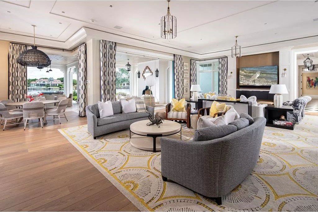 Indulge in the pinnacle of waterfront luxury at 3401 Rum Row, Naples, Florida. This exquisite property, with approximately 130 feet of shoreline, offers unparalleled vistas of Galleon Cove. Crafted by London Bay Construction, Inc. and designed by Stofft Cooney Architects, LLC, it harmonizes opulent interiors by Anthony Catalfano Interiors with lavish outdoor entertainment spaces.