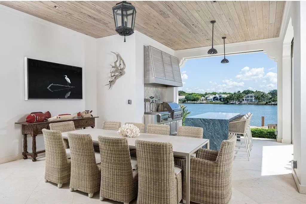 Indulge in the pinnacle of waterfront luxury at 3401 Rum Row, Naples, Florida. This exquisite property, with approximately 130 feet of shoreline, offers unparalleled vistas of Galleon Cove. Crafted by London Bay Construction, Inc. and designed by Stofft Cooney Architects, LLC, it harmonizes opulent interiors by Anthony Catalfano Interiors with lavish outdoor entertainment spaces.