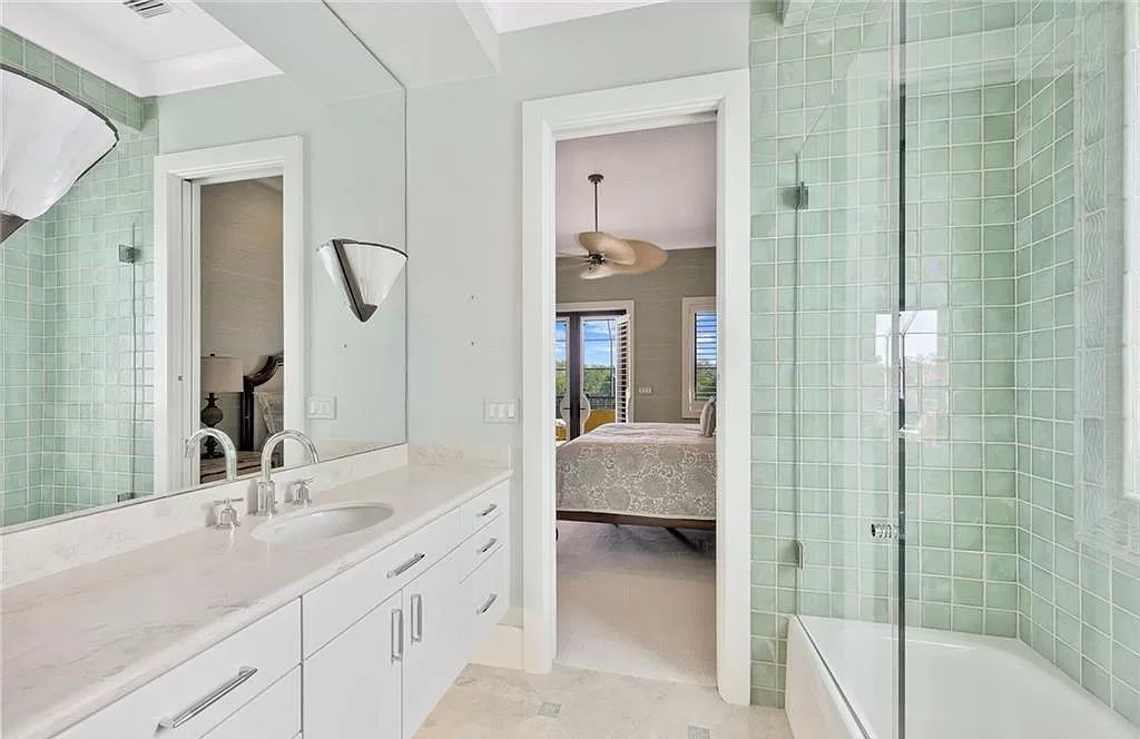 Embrace the pinnacle of coastal luxury at 1450 Gulfstar Dr S, Naples, Florida. Nestled within the exclusive Southpointe Island enclave, this architectural marvel boasts direct Gulf access and recent updates that elevate it to unparalleled sophistication.