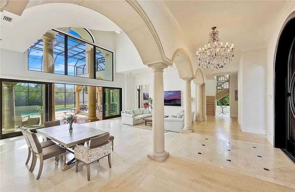 Embrace the pinnacle of coastal luxury at 1450 Gulfstar Dr S, Naples, Florida. Nestled within the exclusive Southpointe Island enclave, this architectural marvel boasts direct Gulf access and recent updates that elevate it to unparalleled sophistication.