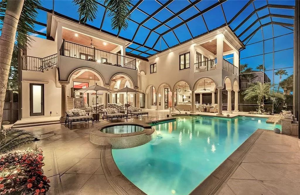 Embrace the pinnacle of coastal luxury at 1450 Gulfstar Dr S, Naples, Florida. Nestled within the exclusive Southpointe Island enclave, this architectural marvel boasts direct Gulf access and recent updates that elevate it to unparalleled sophistication.