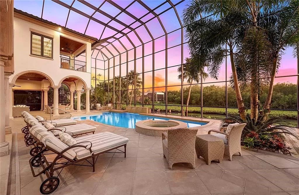 Embrace the pinnacle of coastal luxury at 1450 Gulfstar Dr S, Naples, Florida. Nestled within the exclusive Southpointe Island enclave, this architectural marvel boasts direct Gulf access and recent updates that elevate it to unparalleled sophistication.