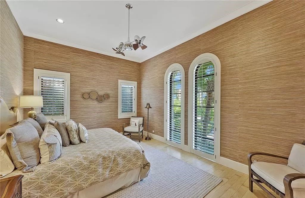 Embrace the pinnacle of coastal luxury at 1450 Gulfstar Dr S, Naples, Florida. Nestled within the exclusive Southpointe Island enclave, this architectural marvel boasts direct Gulf access and recent updates that elevate it to unparalleled sophistication.