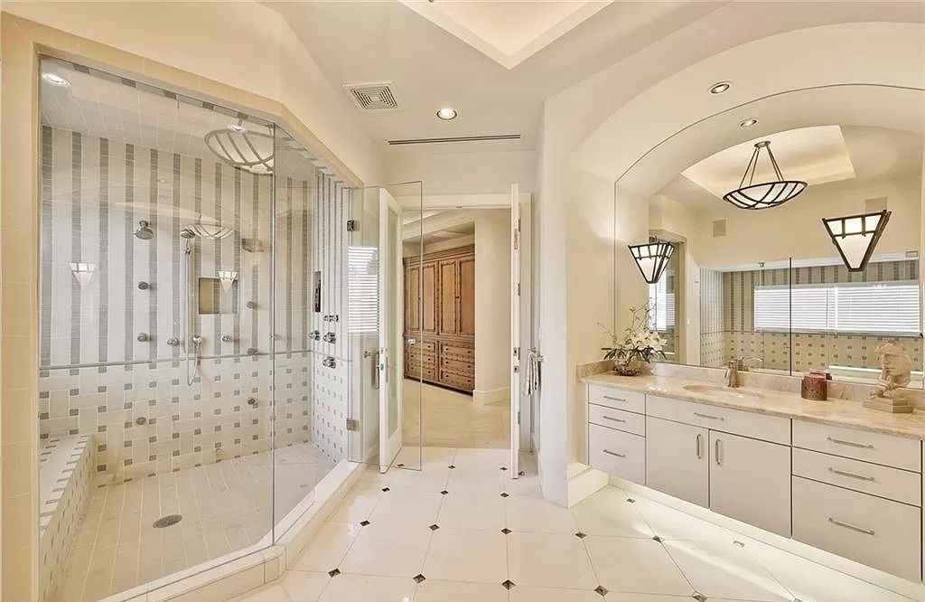Embrace the pinnacle of coastal luxury at 1450 Gulfstar Dr S, Naples, Florida. Nestled within the exclusive Southpointe Island enclave, this architectural marvel boasts direct Gulf access and recent updates that elevate it to unparalleled sophistication.