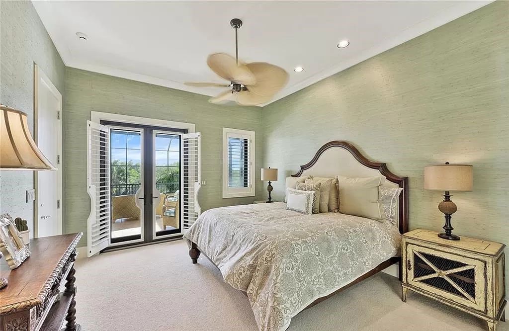 Embrace the pinnacle of coastal luxury at 1450 Gulfstar Dr S, Naples, Florida. Nestled within the exclusive Southpointe Island enclave, this architectural marvel boasts direct Gulf access and recent updates that elevate it to unparalleled sophistication.
