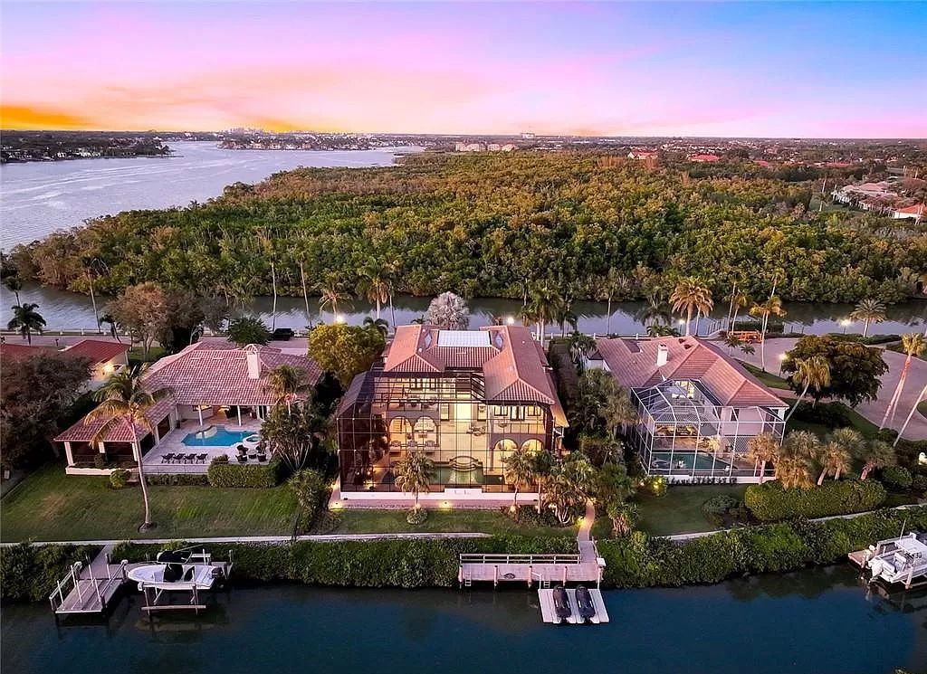 Embrace the pinnacle of coastal luxury at 1450 Gulfstar Dr S, Naples, Florida. Nestled within the exclusive Southpointe Island enclave, this architectural marvel boasts direct Gulf access and recent updates that elevate it to unparalleled sophistication.
