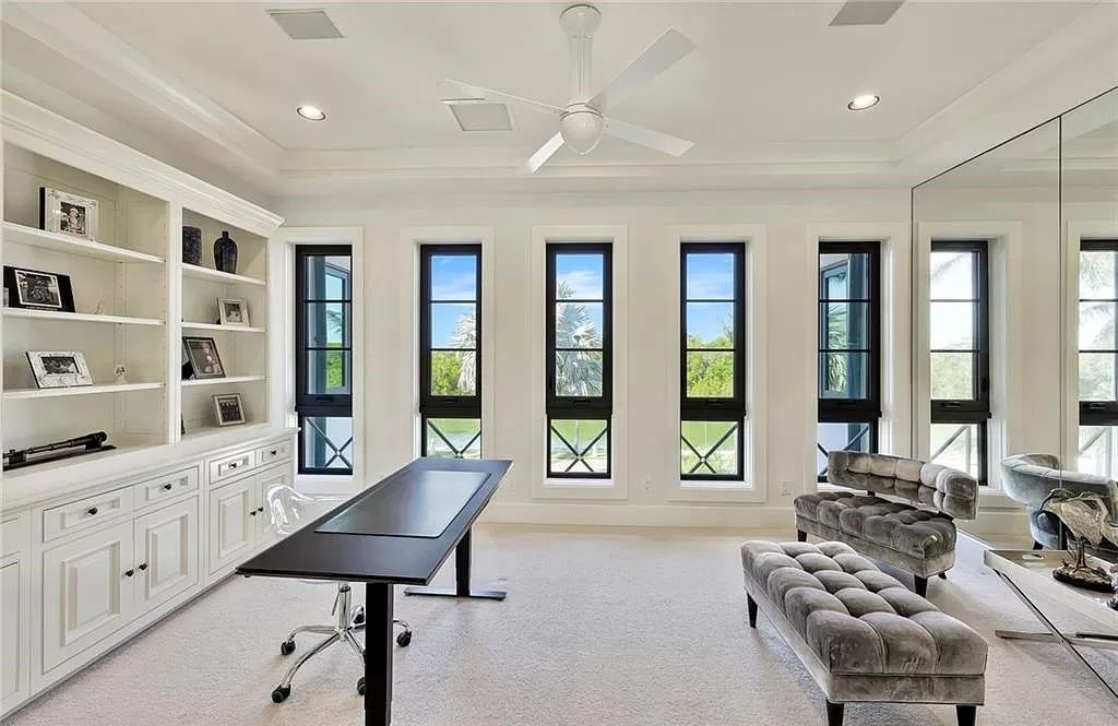 Embrace the pinnacle of coastal luxury at 1450 Gulfstar Dr S, Naples, Florida. Nestled within the exclusive Southpointe Island enclave, this architectural marvel boasts direct Gulf access and recent updates that elevate it to unparalleled sophistication.