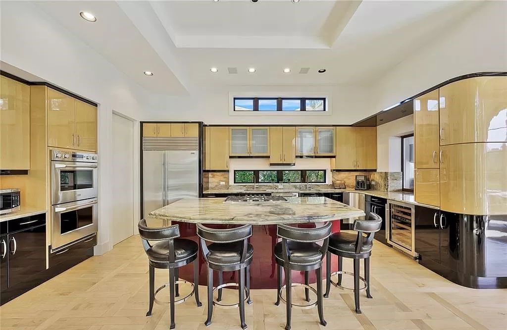 Embrace the pinnacle of coastal luxury at 1450 Gulfstar Dr S, Naples, Florida. Nestled within the exclusive Southpointe Island enclave, this architectural marvel boasts direct Gulf access and recent updates that elevate it to unparalleled sophistication.