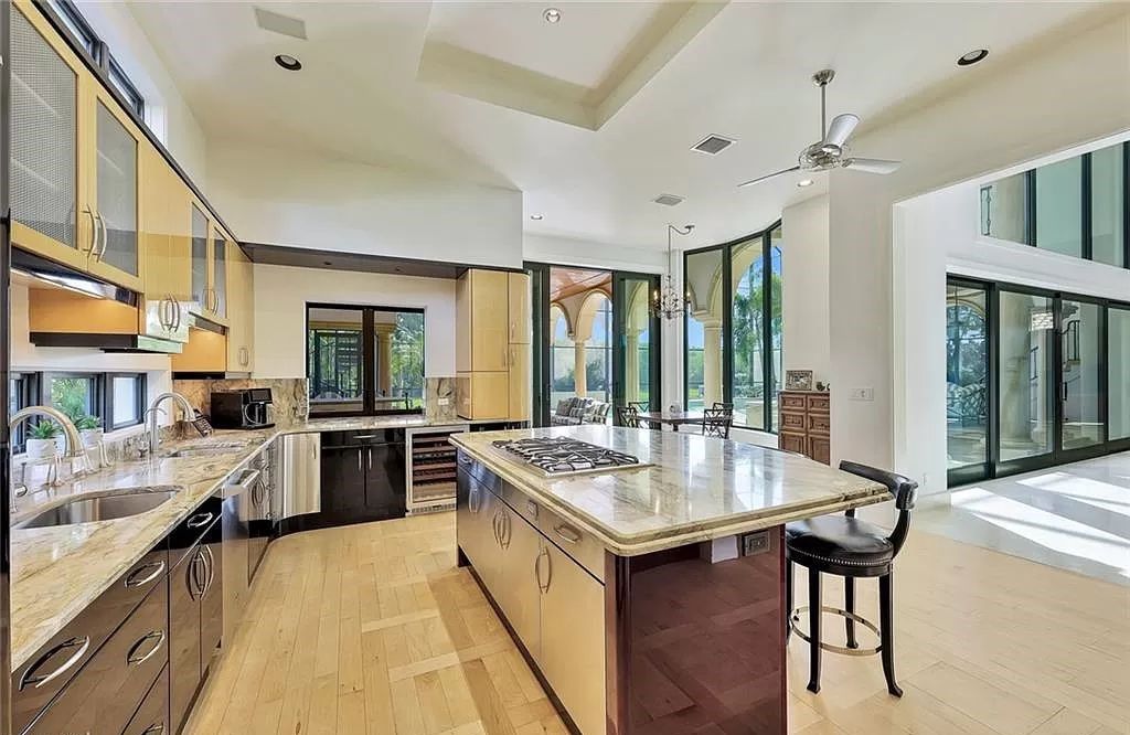 Embrace the pinnacle of coastal luxury at 1450 Gulfstar Dr S, Naples, Florida. Nestled within the exclusive Southpointe Island enclave, this architectural marvel boasts direct Gulf access and recent updates that elevate it to unparalleled sophistication.