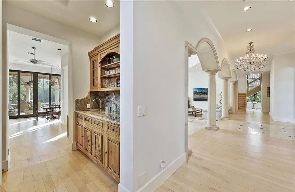 Embrace the pinnacle of coastal luxury at 1450 Gulfstar Dr S, Naples, Florida. Nestled within the exclusive Southpointe Island enclave, this architectural marvel boasts direct Gulf access and recent updates that elevate it to unparalleled sophistication.