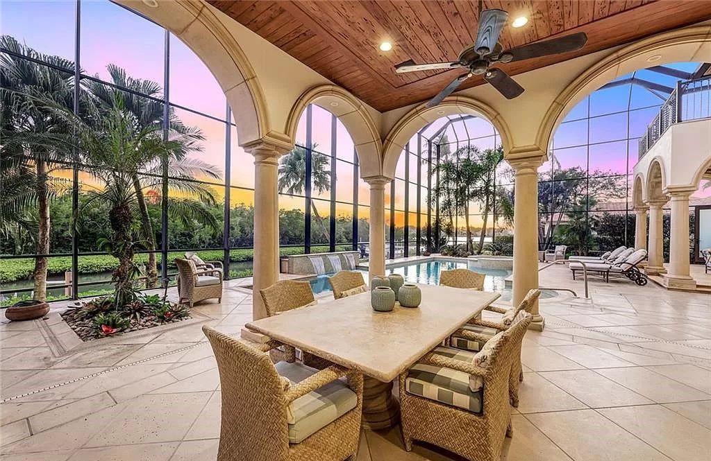 Embrace the pinnacle of coastal luxury at 1450 Gulfstar Dr S, Naples, Florida. Nestled within the exclusive Southpointe Island enclave, this architectural marvel boasts direct Gulf access and recent updates that elevate it to unparalleled sophistication.