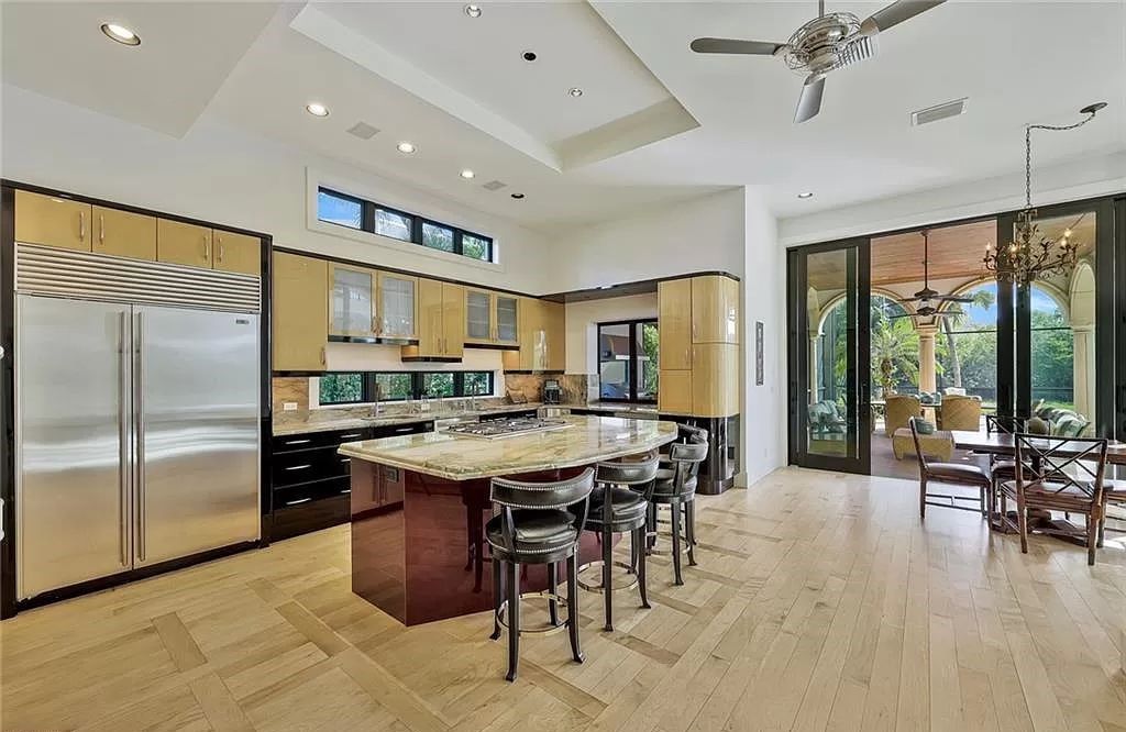 Embrace the pinnacle of coastal luxury at 1450 Gulfstar Dr S, Naples, Florida. Nestled within the exclusive Southpointe Island enclave, this architectural marvel boasts direct Gulf access and recent updates that elevate it to unparalleled sophistication.