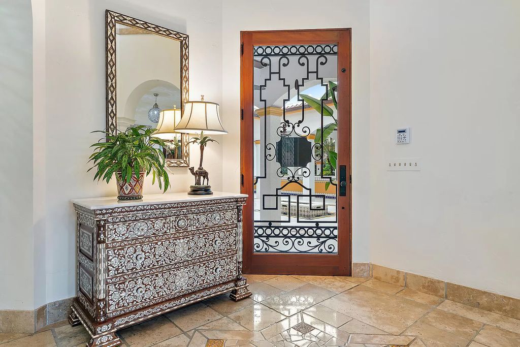 Discover the epitome of refined living at 2929 Marys Way, a Moroccan-inspired waterfront sanctuary in Palm Beach Gardens, Florida. This 5-bed, 9-bath home, remodeled in 2018, boasts 7,175 square feet of meticulously crafted living space on a sprawling 0.68-acre lot.