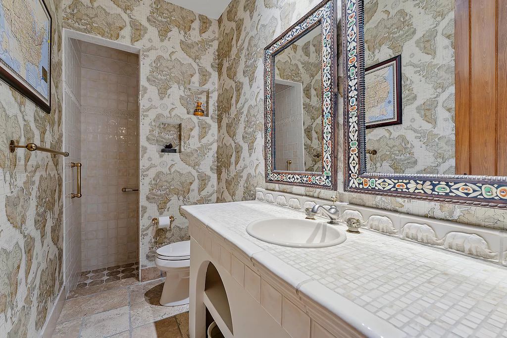 Discover the epitome of refined living at 2929 Marys Way, a Moroccan-inspired waterfront sanctuary in Palm Beach Gardens, Florida. This 5-bed, 9-bath home, remodeled in 2018, boasts 7,175 square feet of meticulously crafted living space on a sprawling 0.68-acre lot.