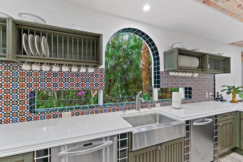 Discover the epitome of refined living at 2929 Marys Way, a Moroccan-inspired waterfront sanctuary in Palm Beach Gardens, Florida. This 5-bed, 9-bath home, remodeled in 2018, boasts 7,175 square feet of meticulously crafted living space on a sprawling 0.68-acre lot.