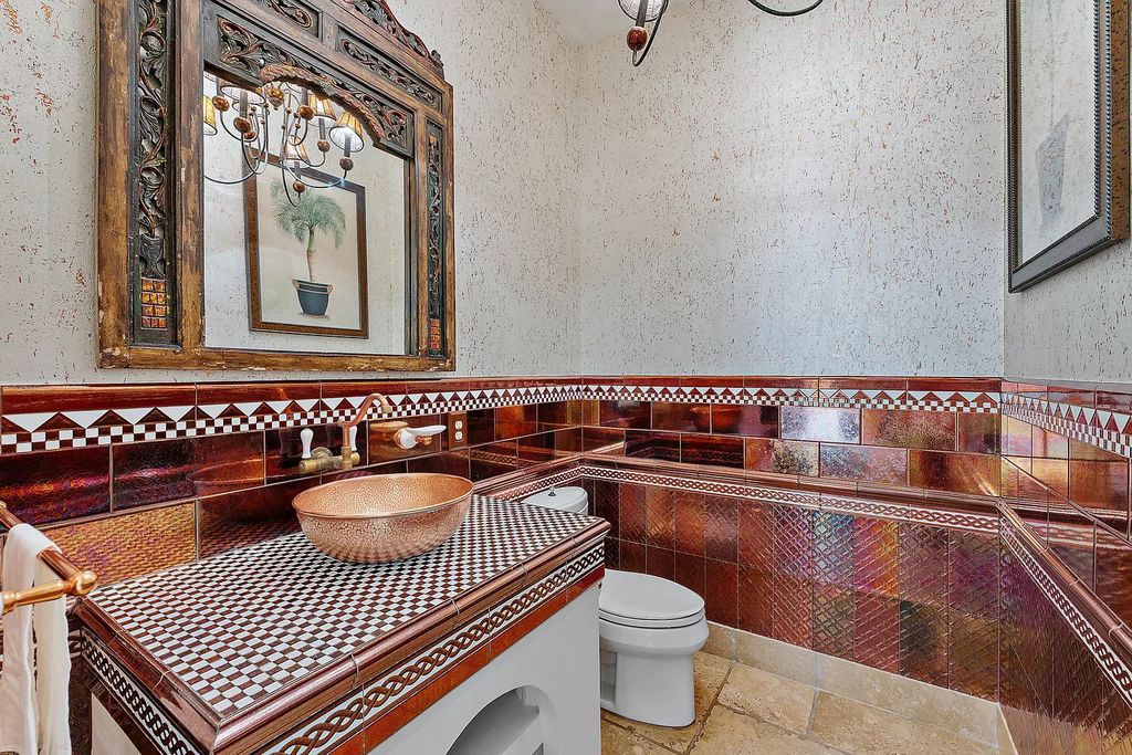 Discover the epitome of refined living at 2929 Marys Way, a Moroccan-inspired waterfront sanctuary in Palm Beach Gardens, Florida. This 5-bed, 9-bath home, remodeled in 2018, boasts 7,175 square feet of meticulously crafted living space on a sprawling 0.68-acre lot.