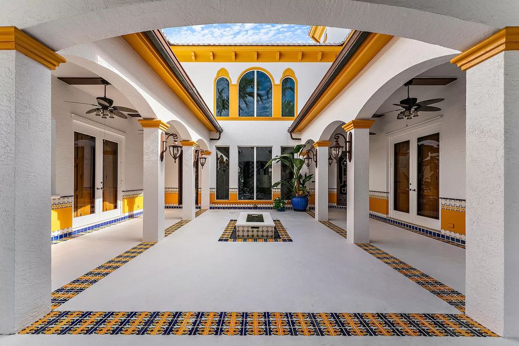 Discover the epitome of refined living at 2929 Marys Way, a Moroccan-inspired waterfront sanctuary in Palm Beach Gardens, Florida. This 5-bed, 9-bath home, remodeled in 2018, boasts 7,175 square feet of meticulously crafted living space on a sprawling 0.68-acre lot.