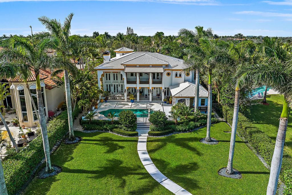 Discover the epitome of refined living at 2929 Marys Way, a Moroccan-inspired waterfront sanctuary in Palm Beach Gardens, Florida. This 5-bed, 9-bath home, remodeled in 2018, boasts 7,175 square feet of meticulously crafted living space on a sprawling 0.68-acre lot.