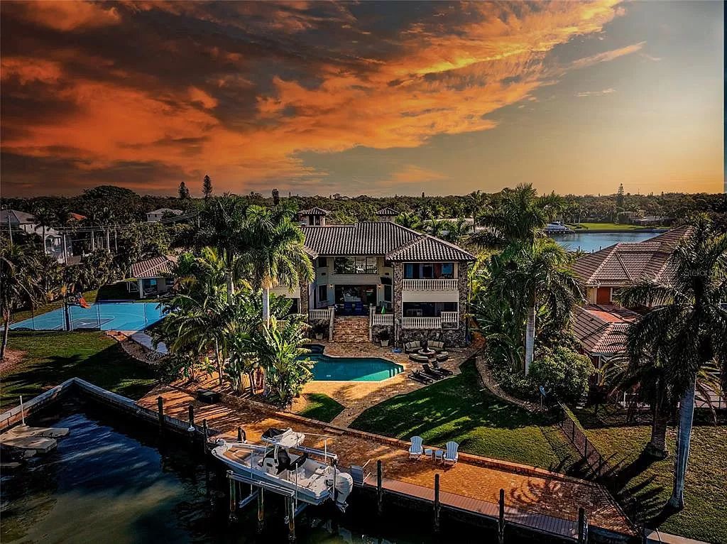 Nestled in the exclusive San Remo Estates of Sarasota, FL, 3544 San Remo Ter presents an extraordinary 8,006 square feet waterfront estate, a harmonious blend of historical charm and modern opulence.
