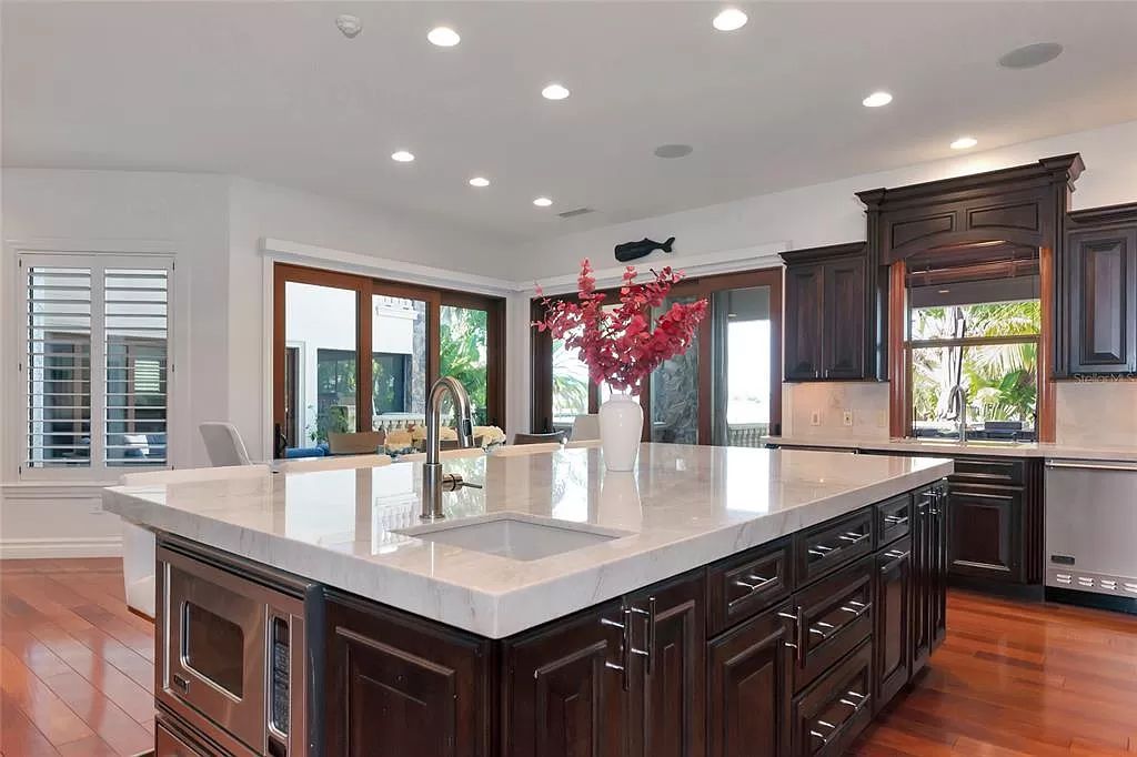 Nestled in the exclusive San Remo Estates of Sarasota, FL, 3544 San Remo Ter presents an extraordinary 8,006 square feet waterfront estate, a harmonious blend of historical charm and modern opulence.