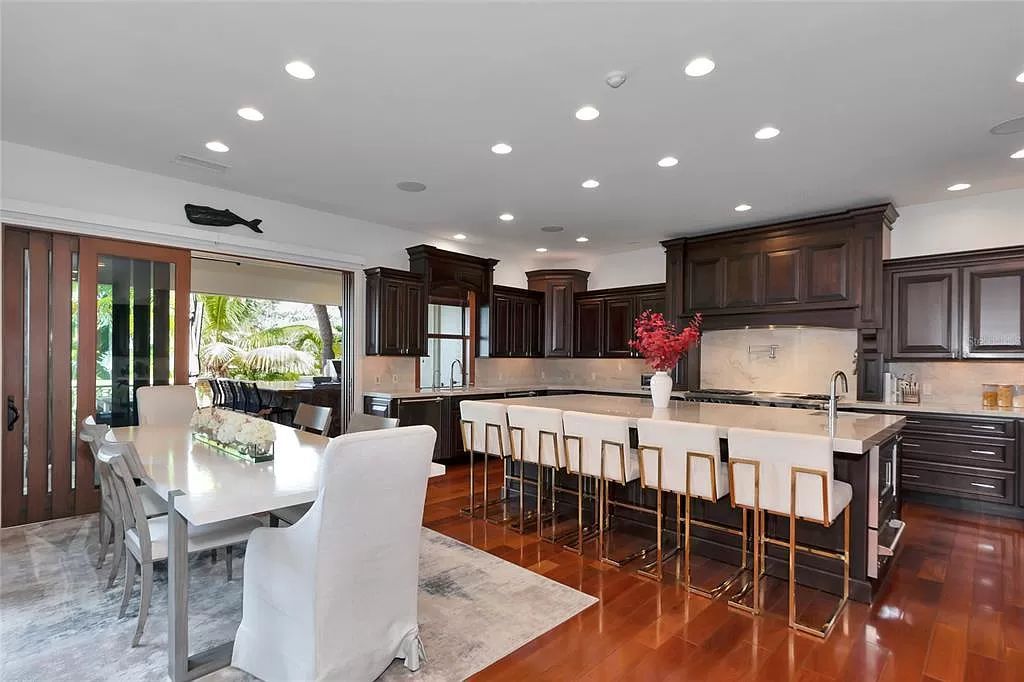 Nestled in the exclusive San Remo Estates of Sarasota, FL, 3544 San Remo Ter presents an extraordinary 8,006 square feet waterfront estate, a harmonious blend of historical charm and modern opulence.