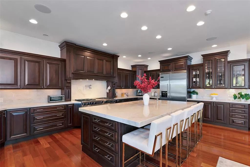 Nestled in the exclusive San Remo Estates of Sarasota, FL, 3544 San Remo Ter presents an extraordinary 8,006 square feet waterfront estate, a harmonious blend of historical charm and modern opulence.
