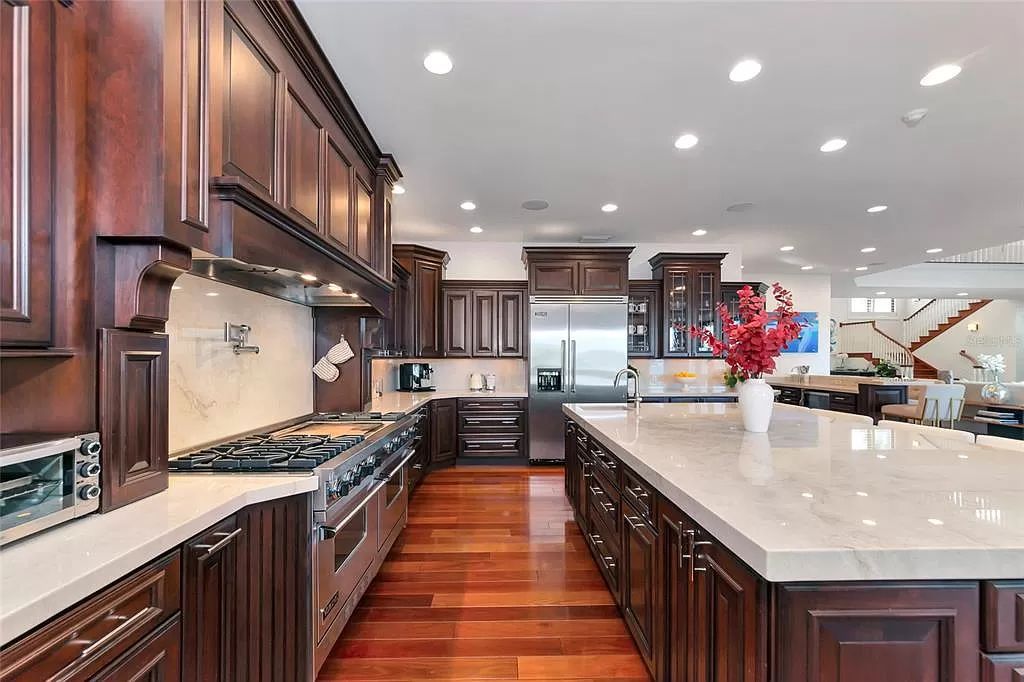 Nestled in the exclusive San Remo Estates of Sarasota, FL, 3544 San Remo Ter presents an extraordinary 8,006 square feet waterfront estate, a harmonious blend of historical charm and modern opulence.