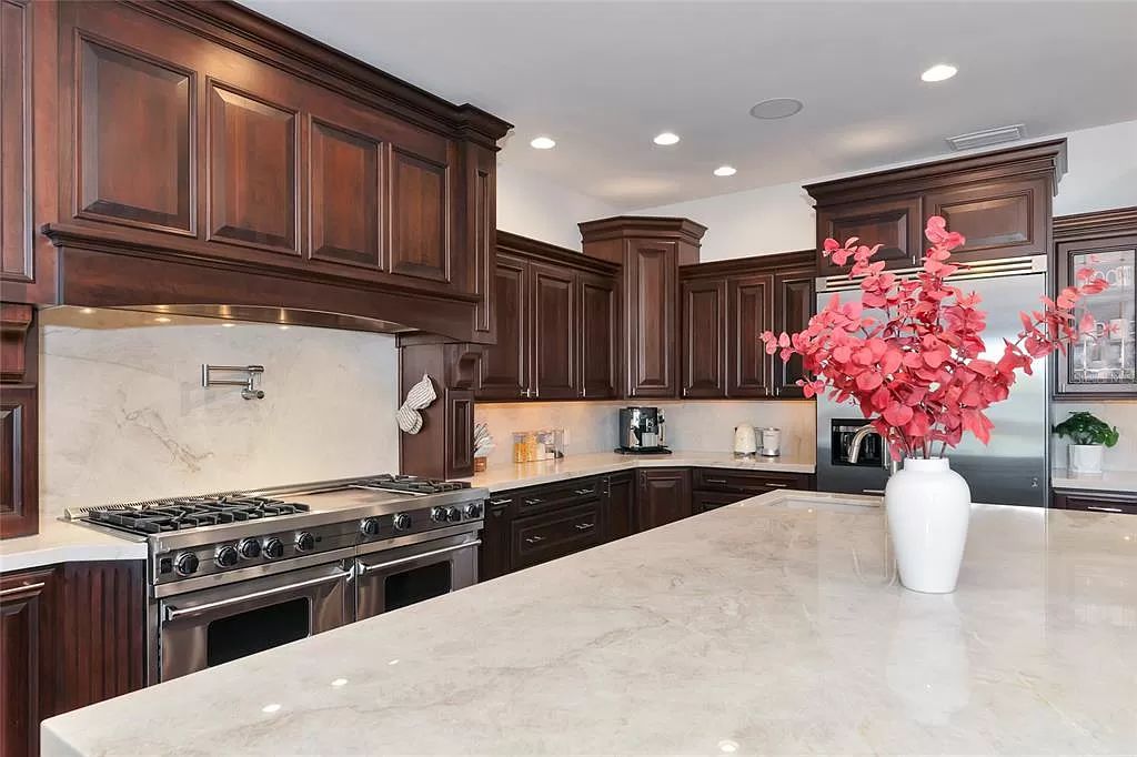 Nestled in the exclusive San Remo Estates of Sarasota, FL, 3544 San Remo Ter presents an extraordinary 8,006 square feet waterfront estate, a harmonious blend of historical charm and modern opulence.
