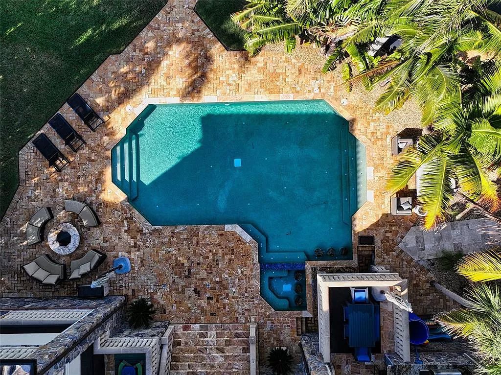 Nestled in the exclusive San Remo Estates of Sarasota, FL, 3544 San Remo Ter presents an extraordinary 8,006 square feet waterfront estate, a harmonious blend of historical charm and modern opulence.