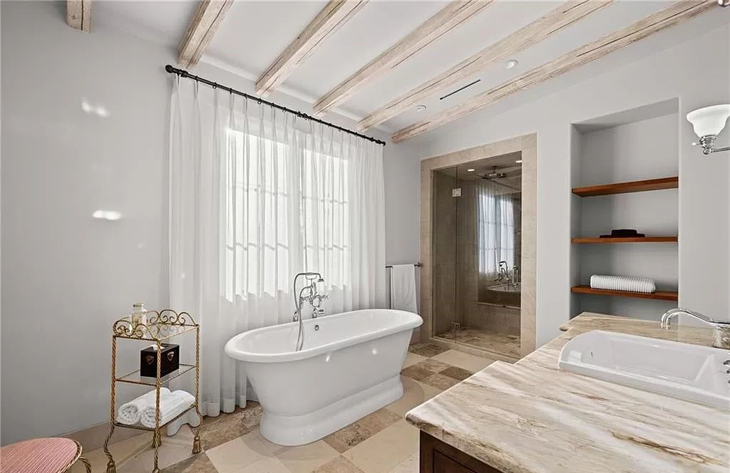 Crafted by London Bay Homes, this 5-bedroom, 8-bathroom masterpiece spans 11,408 square feet on a 1.78-acre lot within the prestigious Mediterra community.