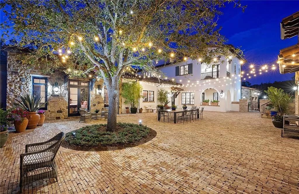 Crafted by London Bay Homes, this 5-bedroom, 8-bathroom masterpiece spans 11,408 square feet on a 1.78-acre lot within the prestigious Mediterra community.