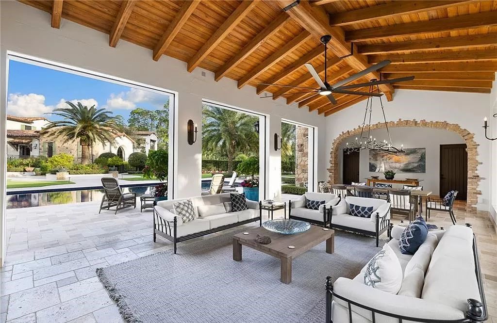 Crafted by London Bay Homes, this 5-bedroom, 8-bathroom masterpiece spans 11,408 square feet on a 1.78-acre lot within the prestigious Mediterra community.