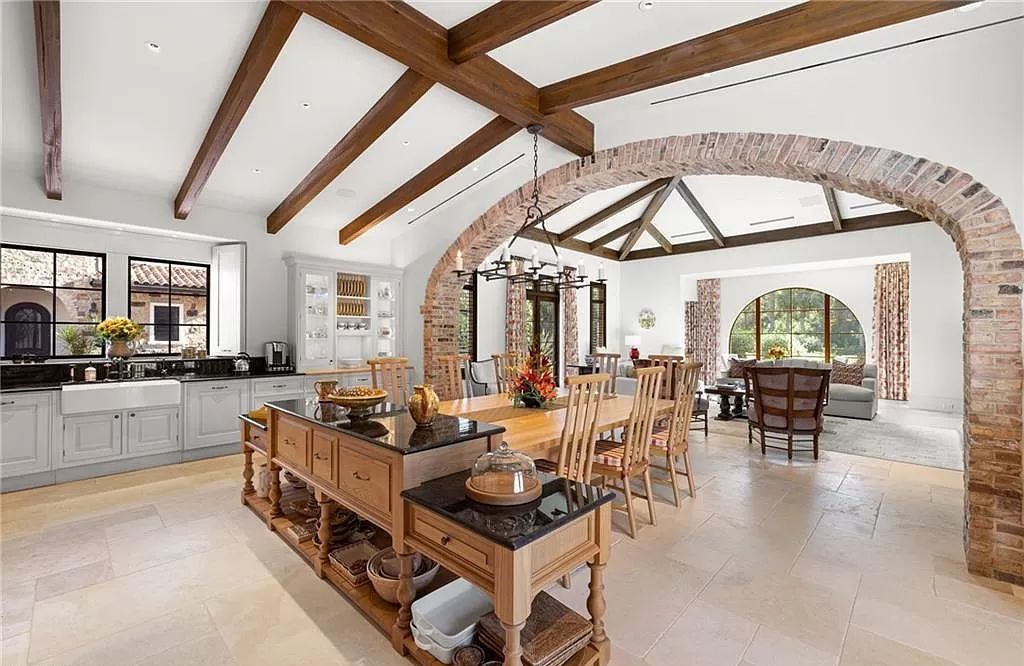 Crafted by London Bay Homes, this 5-bedroom, 8-bathroom masterpiece spans 11,408 square feet on a 1.78-acre lot within the prestigious Mediterra community.