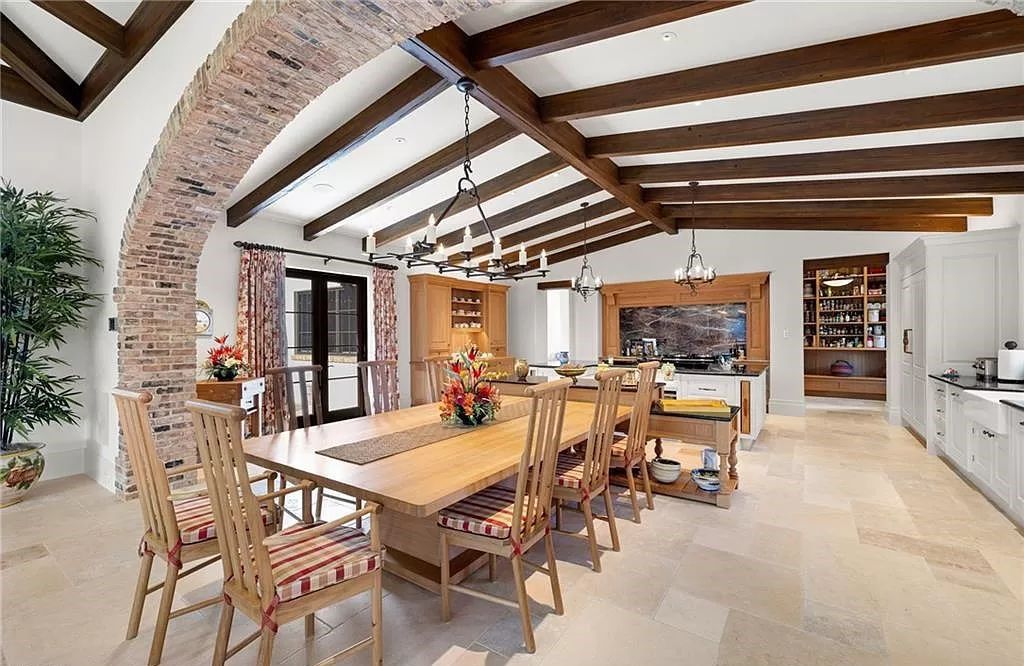 Crafted by London Bay Homes, this 5-bedroom, 8-bathroom masterpiece spans 11,408 square feet on a 1.78-acre lot within the prestigious Mediterra community.